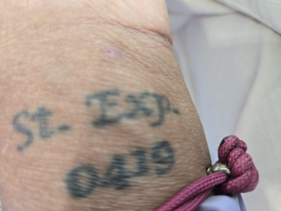 The keeper's wrist tattoo: St. Exp. 04-19, Saint Expedite's feast day